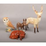 Four Beswick ceramic figures, to include stag deer, fox, owl and donkey. Good condition.