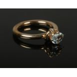 A Pandora 14ct gold aquamarine and diamond ring. Size M.