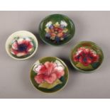 A collection of Moorcroft small bowls, Hibiscus pattern example (approx 8 cm diameter)