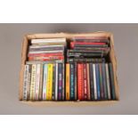 A box of CDs, mainly sealed, to include The Beatles, Guns N' Roses, The Who etc.