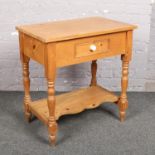 A pine wash stand with single drawer.