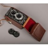 A Rolleicord reflex camera by Franke & Heidecke in original leather cover.