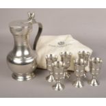 An Italian pewter wine jug and six goblets set