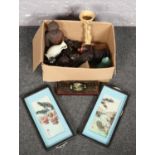 A box of orientalwares to include seated Buddha figures, wall plaques, etc.