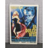 A framed reproduction Selegrafica advertising poster for La Dolce Vita. (96cm x 66cm).