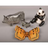 A group of ceramic animals, to include Royal Doulton pigs, Beswick Large Tortoiseshell butterfly and