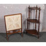 A oak embroided silk fire screen along with a mahogany three tier corner whatnot stand.