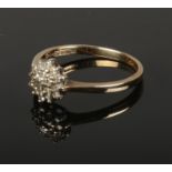 A 9ct gold and diamond cluster ring. (1.6g) (Size K).