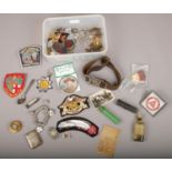 A box of mixed collectables including costume jewellery, embroidered advertising patches, vintage