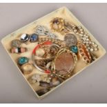 A box of miscellaneous vintage jewellery to include rings, brooches, bracelets etc.