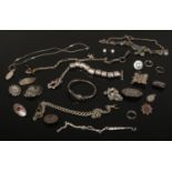 A collection of silver and white metal jewellery and oddments including Albert chains, niello and