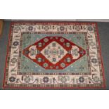 A red ground rug with geometric design. (229cm x 168cm).