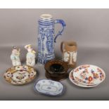 A large German Westerwald pottery ewer, Jasperware jug, spitoon, pair of coloured bisque figures,