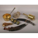 A collection of metalwares, to include Gurkha knives, copper and brass powder flask, meat spit etc.