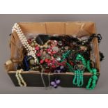 A box of costume jewellery, necklaces, beads