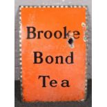 A 1940s enamel advertising sign for Brooke Bond Tea.