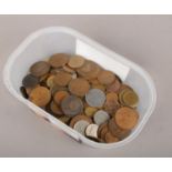 A collection of British and foreign coins to include German, Italy, British pennies etc.