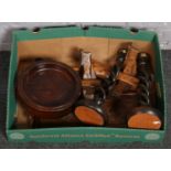 A box of wooden items to include twist candlesticks, bowl, twin handled tray etc.