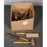 A box of mostly vintage wood plumbing tools to include lead working examples etc.