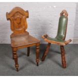 A carved oak hall chair, along with an oak and leather three legged spinning chair. Hall chair