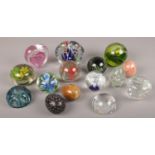 A collection of paperweights to include glass and onyx examples etc.