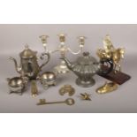 A collection of metalwares, to include silverplate teaset, candelabra, brass figure on horseback