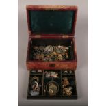 A jewellery box of vintage jewellery to include rings, pendants on chain, brooches etc.