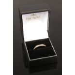 A 9 ct gold & diamond eternity ring (size P )