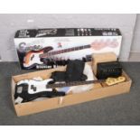 A boxed Encore Blaster left handed bass guitar pack, to include guitar, amp, carry bag etc.