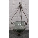 A glass/metal hanging terrarium