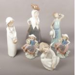 A collection of Lladro & Nao ceramic figures, 4961 Angel dreaming, girls with flower basket, lady