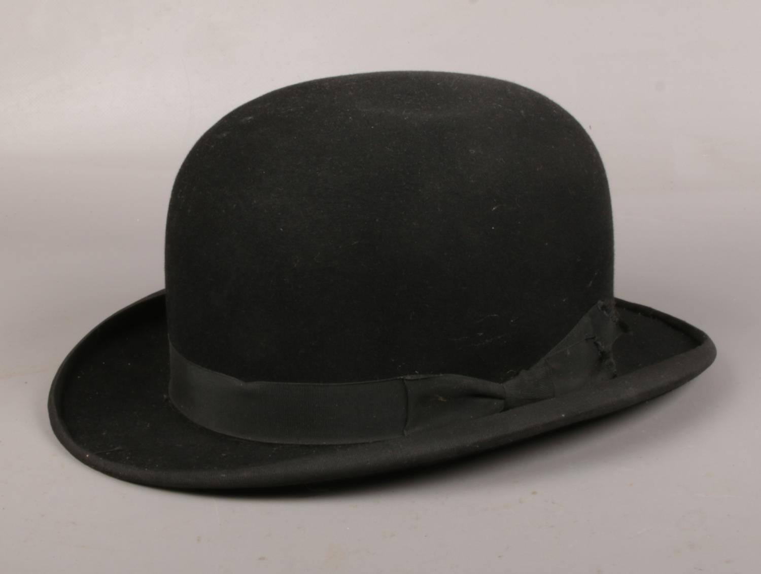 An early-mid 20th century gentleman's bowler hat. MArked inside Latest Style, Adaptus.