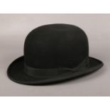 An early-mid 20th century gentleman's bowler hat. MArked inside Latest Style, Adaptus.