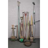 A collection of garden tools to include petrol gardenlite hedge trimmer, shovels, rake, etc.