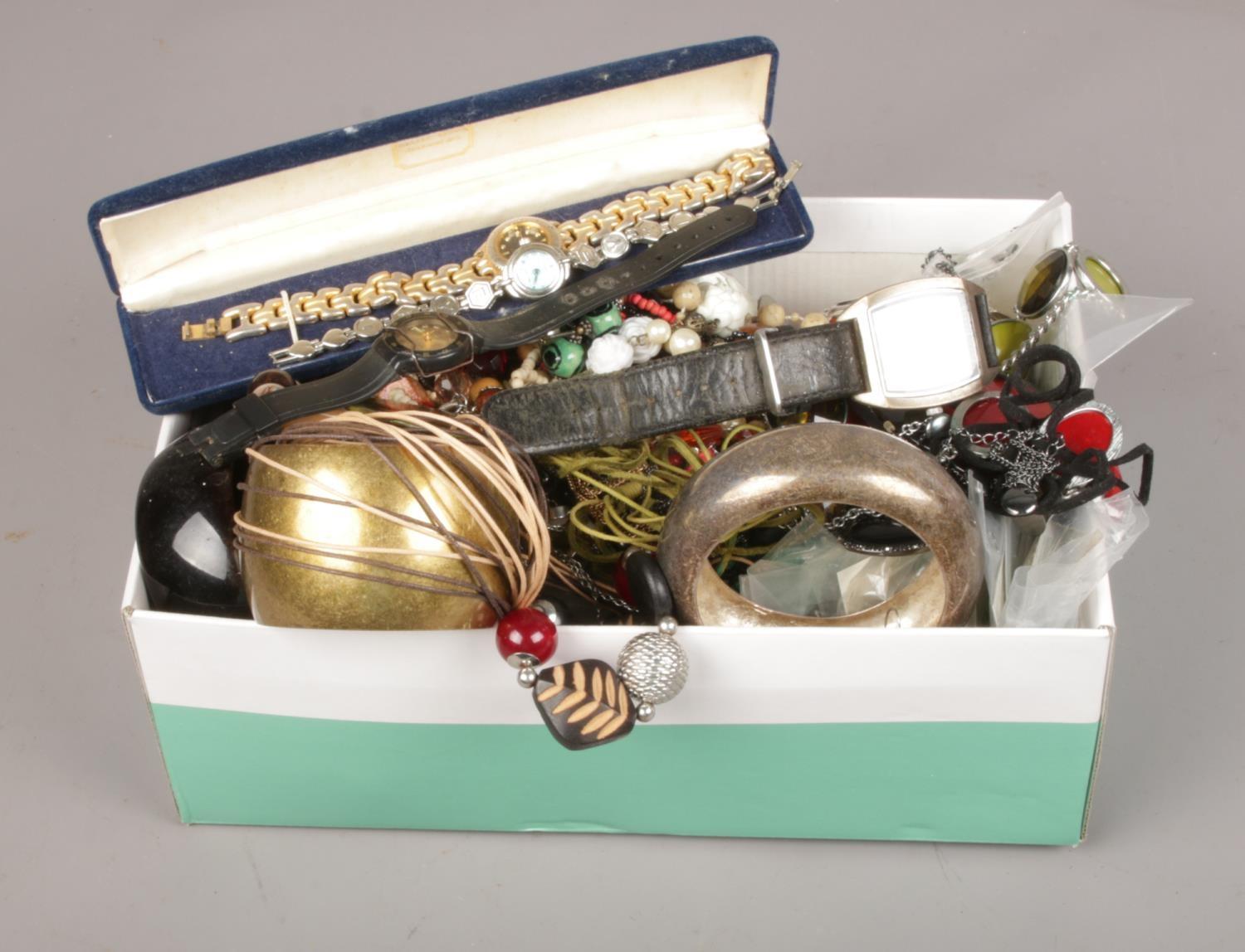 A box of costume jewellery, bangles, necklaces, quartz wristwatches etc