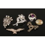 Six silver brooches including marcasite and pearl spray brooches etc.
