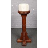 A Victorian marble font on pitch pine stand.