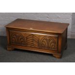 A carved oak blanket box.