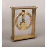 A Kaiser brass cased 7 jewel 8 day carriage clock. With perspex front and back and floating skeleton