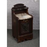 An Edwardian carved mahogany perdonium with marble top.