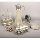 A collection of silver plate including a Victorian six bottle cruet set, claret jug, tureen and
