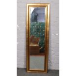 A modern gilt frame full length bevel edge wall mirror.