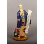 A Royal Doulton figure of Ko Ko from the Mikado collection, 29.5cm. Some good restoration.