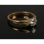 A 18ct gold and diamond ring, approximately 0.5 carat diamond, size N, gross weight 3.46g.
