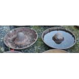 Two cast iron Mexican hat shaped troughs. One with crack.