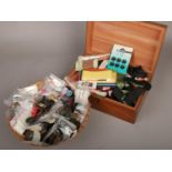 A wooden box and basket of sewing equipment, to include buttons, needles etc.