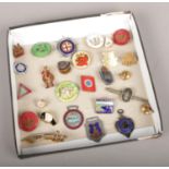 A collection of metal badges, Civil Nursing Reserve, National Cycling Proficiency, British Legion,