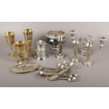 A collection of silver plate, candelabra, bud vases, goblets, cutlery etc