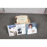 A collection of vinyl records, Paul McCartney, Lionel Richie, Madonna examples