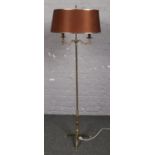 A decorative brass twin branch standard lamp.